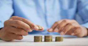 small piles of coin for a budget