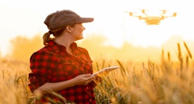 GFO Farmer controls a drone with a tablet