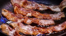 Bacon frying in a pan